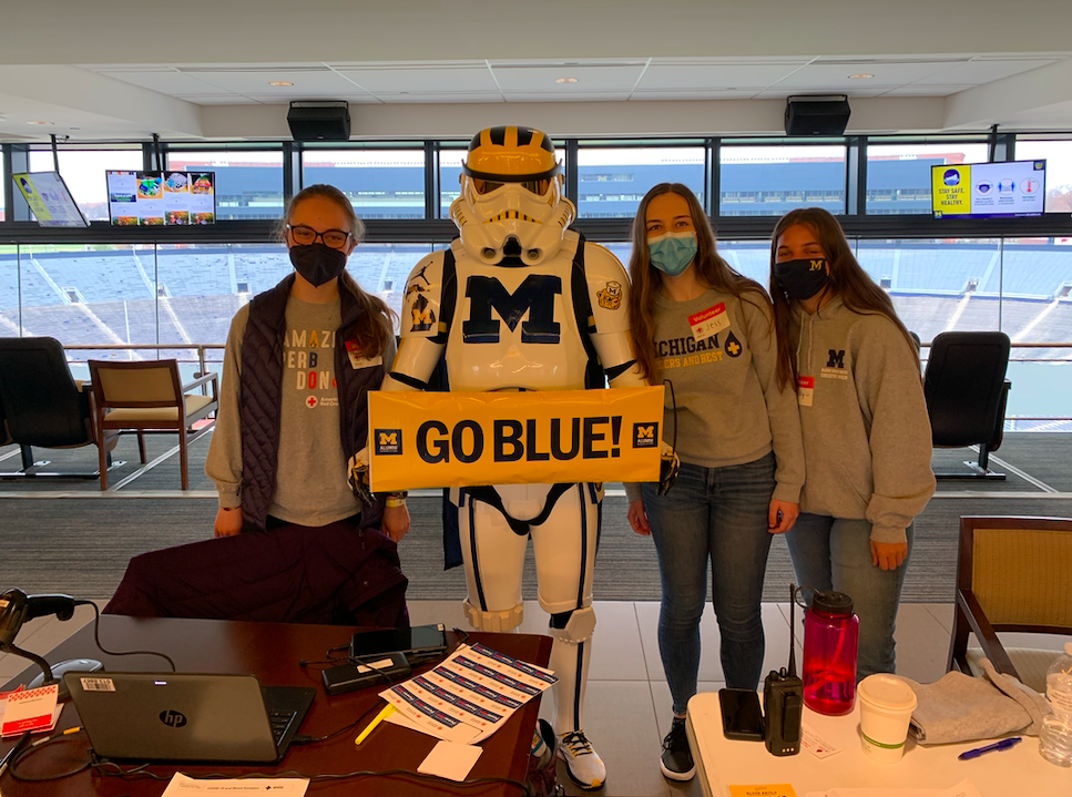 BDU volunteers with a Michigan stormtrooper at check-in