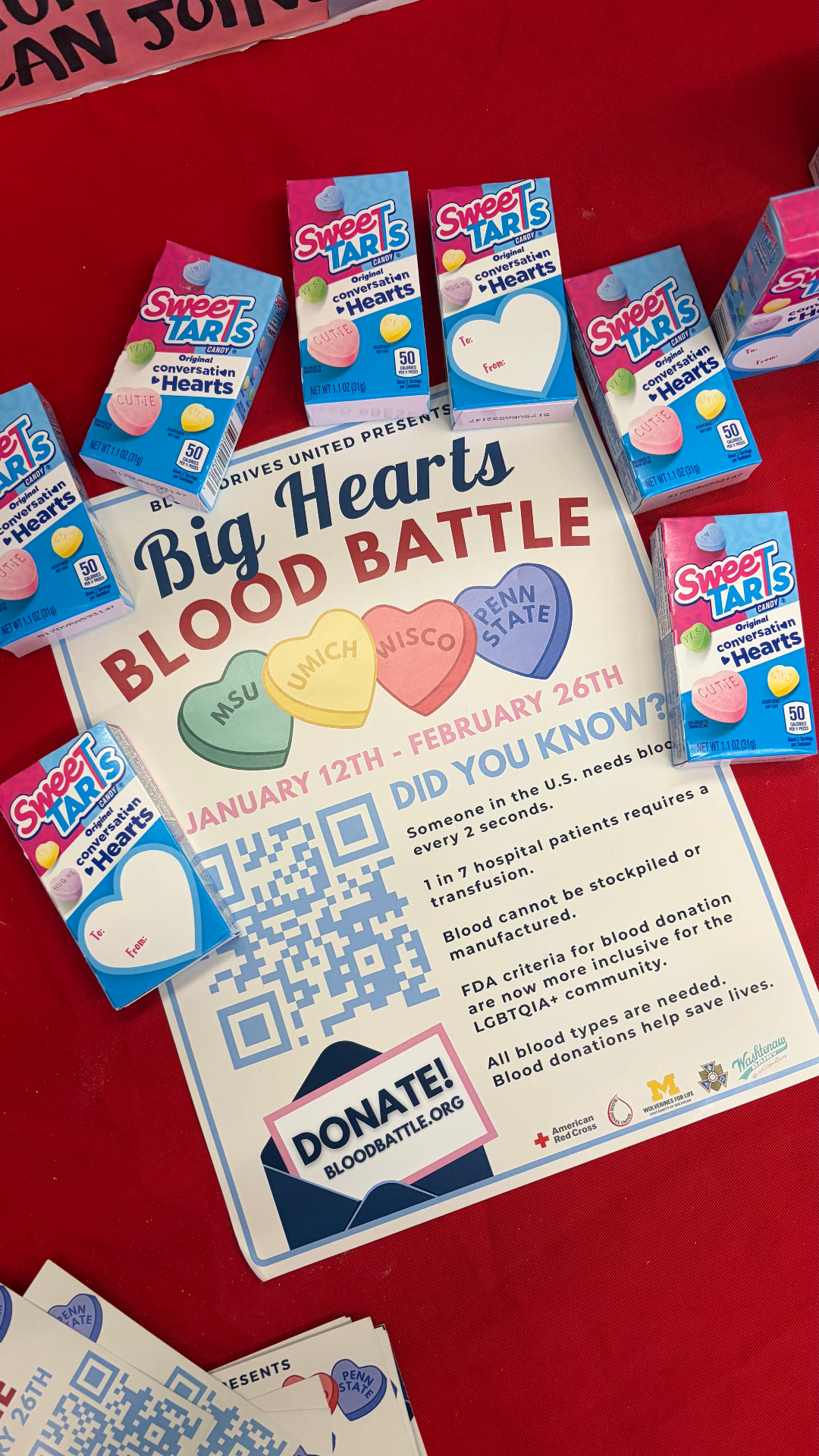 Big Hearts Blood Battle flyers surrounded by candy hearts
