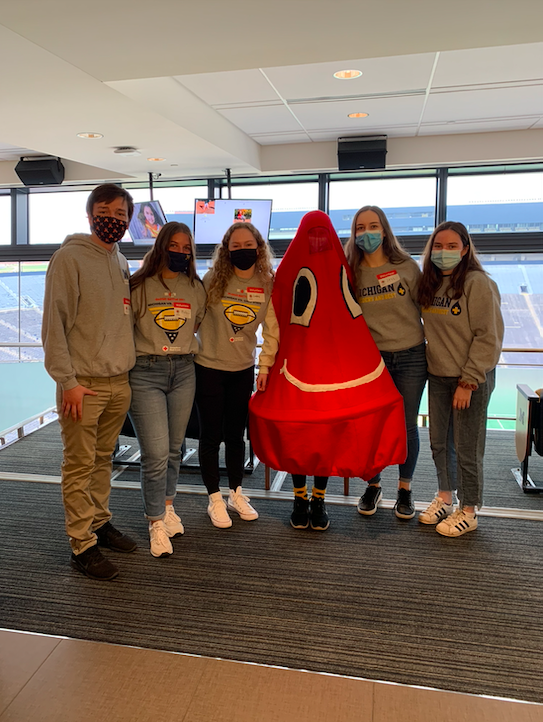 BDU volunteers posing with a red blood drop mascot